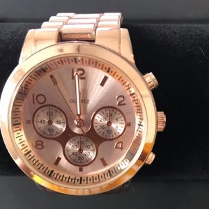 Rose gold linked watched